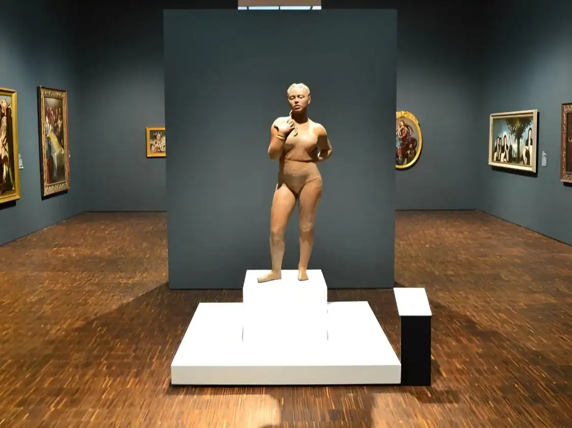 Ancient Greek sculpture of a standing female figure in an art gallery.