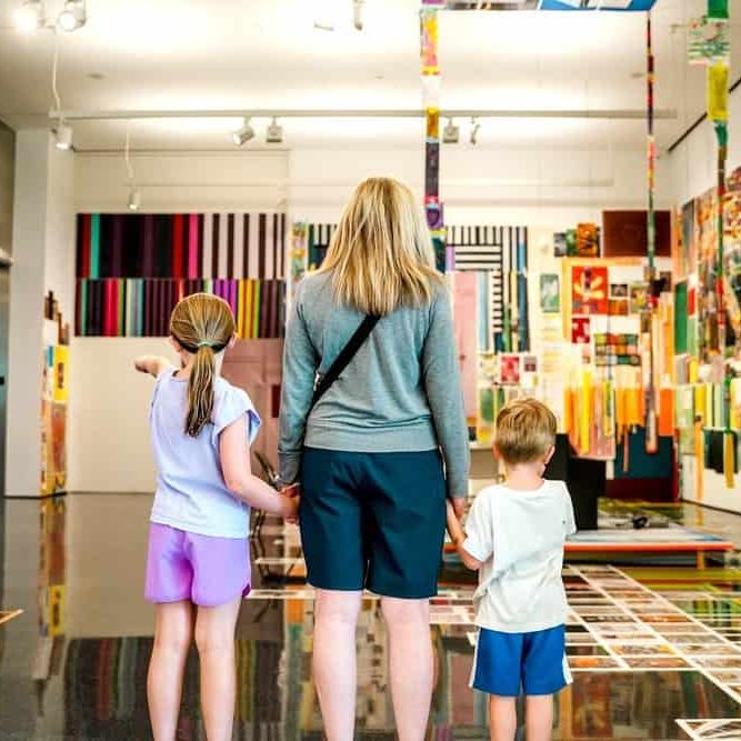 Family exploring vibrant contemporary art displays at The Cultural Trust gallery.