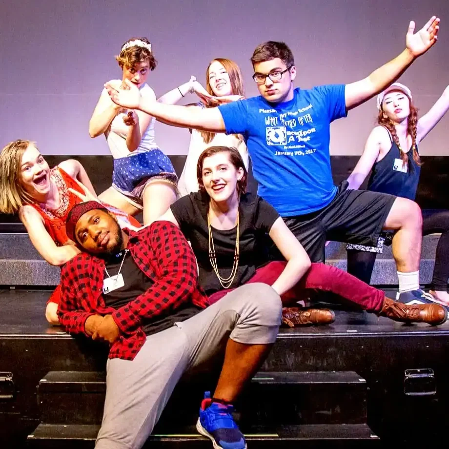 Performers on stage during a youth theater production at The Cultural Trust.